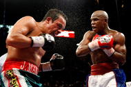LAS VEGAS - SEPTEMBER 19:  Juan Manuel Marquez (L) and Floyd Mayweather Jr. battle in the ninth round of their fight at the MGM Grand Garden Arena September 19, 2009 in Las Vegas, Nevada. Mayweather won by unanimous decision.  (Photo by Ethan Miller/Getty Images)