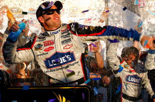 AVONDALE, AZ - NOVEMBER 15:  Jimmie Johnson, driver of the #48 Lowe's Chevrolet, celebrates in victory lane after winning the NASCAR Sprint Cup Series Checker O'Reilly Auto Parts 500 at Phoenix International Raceway on November 15, 2009 in Avondale, Arizona.  (Photo by Jason Smith/Getty Images for NASCAR)
