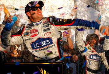 AVONDALE, AZ - NOVEMBER 15:  Jimmie Johnson, driver of the #48 Lowe's Chevrolet, celebrates in victory lane after winning the NASCAR Sprint Cup Series Checker O'Reilly Auto Parts 500 at Phoenix International Raceway on November 15, 2009 in Avondale, Arizona.  (Photo by Jason Smith/Getty Images for NASCAR)
