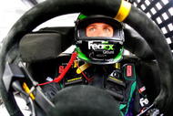 AVONDALE, AZ - NOVEMBER 14:  Denny Hamlin, sits aboard the #11 Fed Ex Ground Toyota during practice for the NASCAR Sprint Cup Series Checker O'Reilly Auto Parts 500 at Phoenix International Raceway on November 14, 2009 in Avondale, Arizona.  (Photo by Jason Smith/Getty Images for NASCAR)