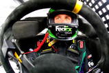 AVONDALE, AZ - NOVEMBER 14:  Denny Hamlin, sits aboard the #11 Fed Ex Ground Toyota during practice for the NASCAR Sprint Cup Series Checker O'Reilly Auto Parts 500 at Phoenix International Raceway on November 14, 2009 in Avondale, Arizona.  (Photo by Jason Smith/Getty Images for NASCAR)