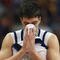 TAMPA, FL - MARCH 21: Jonathan Cox #31 of the Drake Bulldogs wipes his face as he leaves the court following his team's 101-99 overime loss to the Western Kentucky Hilltoppers in the first round of the 2008 NCAA Tournament West Regional at the St. Pete Times Forum on March 21, 2008 in Tampa, Florida.  (Photo by Doug Benc/Getty Images)