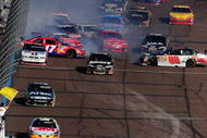 AVONDALE, AZ - NOVEMBER 15:  A multi car incident involving Dale Earnhardt Jr. driver of the #88 AMP Energy/National Guard Chevrolet takes place on the frontstrech during the NASCAR Sprint Cup Series Checker O'Reilly Auto Parts 500 at Phoenix International Raceway on November 15, 2009 in Avondale, Arizona.  (Photo by Robert Laberge/Getty Images for NASCAR)