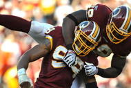 LANDOVER, MD - NOVEMBER 15:  Andre Carter #99 of the Washington Redskins celebrates a sack against the Denver Broncos at FedExField on November 15, 2009 in Landover, Maryland. The Redskins defeated the Broncos 27-17. (Photo by Larry French/Getty Images)