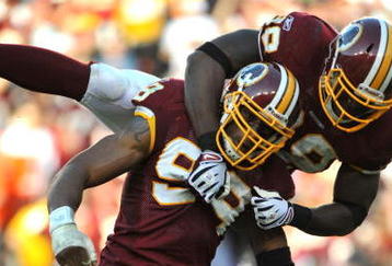 LANDOVER, MD - NOVEMBER 15:  Andre Carter #99 of the Washington Redskins celebrates a sack against the Denver Broncos at FedExField on November 15, 2009 in Landover, Maryland. The Redskins defeated the Broncos 27-17. (Photo by Larry French/Getty Images)