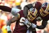 LANDOVER, MD - NOVEMBER 15:  Andre Carter #99 of the Washington Redskins celebrates a sack against the Denver Broncos at FedExField on November 15, 2009 in Landover, Maryland. The Redskins defeated the Broncos 27-17. (Photo by Larry French/Getty Images)