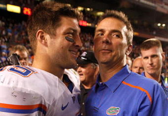 COLUMBIA, SC - NOVEMBER 14:  Head coach Urban Meyer and quarterback Tim Tebow #15 of the Florida Gators celebrate after a 24-14 victory over the South Carolina Gamecocks during their game at Williams-Brice Stadium on November 14, 2009 in Columbia, South Carolina.  (Photo by Streeter Lecka/Getty Images)