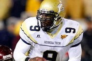 ATLANTA - OCTOBER 17:  Quarterback Josh Nesbitt #9 of the Georgia Tech Yellow Jackets rushes upfield away from Nekos Brown #47 of the Virginia Tech Hokies at Bobby Dodd Stadium on October 17, 2009 in Atlanta, Georgia.  (Photo by Kevin C. Cox/Getty Images)
