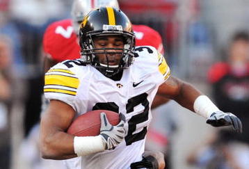 COLUMBUS, OH - NOVEMBER 14:  Running back Adam Robinson #32 of the Iowa Hawkeyes is brought down by Doug Worthington #84 of the Ohio State Buckeyes at Ohio Stadium on November 14, 2009 in Columbus, Ohio.  (Photo by Jamie Sabau/Getty Images)
