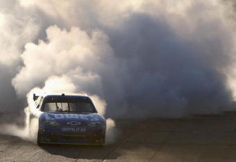 AVONDALE, AZ - NOVEMBER 15:  Jimmie Johnson, driver of the #48 Lowe's Chevrolet, performs a burnout after winning the NASCAR Sprint Cup Series Checker O'Reilly Auto Parts 500 at Phoenix International Raceway on November 15, 2009 in Avondale, Arizona.  (Photo by Christian Petersen/Getty Images)