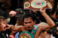 LAS VEGAS - NOVEMBER 14:  Manny Pacquiao celebrates his 12 round TKO victory against Miguel Cotto during their WBO welterweight title fight at the MGM Grand Garden Arena on November 14, 2009 in Las Vegas, Nevada.  (Photo by Ethan Miller/Getty Images)