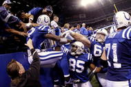 INDIANAPOLIS - NOVEMBER 15:  Reggie Wayne #87 of the Indianapolis Colts celebrates his touchdown with teammates and fans in the fourth quarter of the game against the New England Patriots at Lucas Oil Stadium on November 15, 2009 in Indianapolis, Indiana.  (Photo by Jamie Squire/Getty Images)