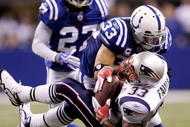 INDIANAPOLIS - NOVEMBER 15:  Melvin Bullitt #33 of the Indianapolis Colts tackles Kevin Faulk #33 of the New England Patriots short of a first down to gain possesion late in the fourth quarter of the game at Lucas Oil Stadium on November 15, 2009 in Indianapolis, Indiana. The Colts won the 35-34. (Photo by Jamie Squire/Getty Images)