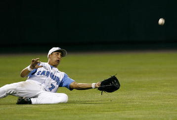 OMAHA, NE - JUNE 24:  Leftfielder Reid Fronk #7 of the North Carolina Tar Heels attempts to make a sliding catch in the outfield during their 9-3 loss to the Oregon State Beavers in Game 2 of the NCAA College World Series Championship at Rosenblatt Stadium on June 24, 2007 in Omaha, Nebraska. (Photo by Kevin C. Cox/Getty Images)