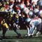 25 Nov 1995: Ohio State and Michigan go head to head in Michigan's 31-23 victory over Ohio State at Michigan Stadium in Ann Arbor, Michigan.