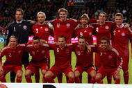 COPENHAGEN, DENMARK - OCTOBER 14:  Denmark players pose for a group photograph after the national anthem during the FIFA 2010 group one World Cup Qualifying match between Denmark and Hungary at the Parken stadium on October 14, 2009 in Copenhagen, Denmark.  (Photo by Clive Brunskill/Getty Images)