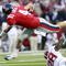 OXFORD, MS - OCTOBER 10:  Quarterback Jevan Snead #4 of the Mississippi Rebels is upset by Javier Arenas #28 of the Alabama Crimson Tide during their college football game at Vaught-Hemingway Stadium on October 10, 2009 in Oxford, Mississippi. (Photo by Dave Martin/Getty Images)