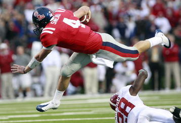 OXFORD, MS - OCTOBER 10:  Quarterback Jevan Snead #4 of the Mississippi Rebels is upset by Javier Arenas #28 of the Alabama Crimson Tide during their college football game at Vaught-Hemingway Stadium on October 10, 2009 in Oxford, Mississippi. (Photo by Dave Martin/Getty Images)