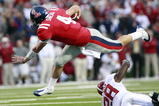 OXFORD, MS - OCTOBER 10:  Quarterback Jevan Snead #4 of the Mississippi Rebels is upset by Javier Arenas #28 of the Alabama Crimson Tide during their college football game at Vaught-Hemingway Stadium on October 10, 2009 in Oxford, Mississippi. (Photo by Dave Martin/Getty Images)