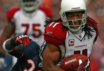 CHICAGO - NOVEMBER 08: Larry Fitzgerald #11 of the Arizona Cardinals shakes off a tackle attempt by Charles Tillman #33 of the Chicago Bears to score a touchdown at Soldier Field on November 8, 2009 in Chicago, Illinois. The aCardinals defeated the Bears 41-21. (Photo by Jonathan Daniel/Getty Images)