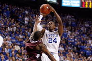 LEXINGTON, KY - NOVEMBER 02:  Eric Bledsoe #24 of the Kentucky Wildcats shoots the ball while defended by T.J. Bishop #1 of the Campbellsville University Tigers during the gameat Rupp Arena on November 2, 2009 in Lexington, Kentucky.  (Photo by Andy Lyons/Getty Images)