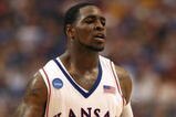 MINNEAPOLIS - MARCH 22:  Sherron Collins #4 of the Kansas Jayhawks reacts against the Dayton Flyers during the second round of the NCAA Division I Men's Basketball Tournament at the Hubert H. Humphrey Metrodome on March 22, 2009 in Minneapolis, Minnesota.  (Photo by Jonathan Daniel/Getty Images)