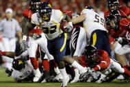 CINCINNATI - NOVEMBER 13:  Ryan Clarke #32 of the West Virginia Mountaineers rushes for a 37 yard touchdown in the second quarter of the game against the Cincinnati Bearcats in at Nippert Stadium on November 13, 2009 in Cincinnati, Ohio.  (Photo by Andy Lyons/Getty Images)