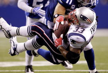 INDIANAPOLIS - NOVEMBER 15:  Melvin Bullitt #33 of the Indianapolis Colts tackles Kevin Faulk #33 of the New England Patriots short of a first down to gain possesion late in the fourth quarter of the game at Lucas Oil Stadium on November 15, 2009 in Indianapolis, Indiana. The Colts won the 35-34. (Photo by Jamie Squire/Getty Images)