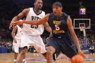 NEW YORK - MARCH 12:  Kevin Jones #5 of the West Virginia Mountaineers dribbles the ball against Sam Young #23 of the Pittsburgh Panthers during the second round of the Big East Tournament at Madison Square Garden on March 12, 2009 in New York City. (Photo by: Jim McIsaac/Getty Images)