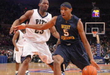NEW YORK - MARCH 12:  Kevin Jones #5 of the West Virginia Mountaineers dribbles the ball against Sam Young #23 of the Pittsburgh Panthers during the second round of the Big East Tournament at Madison Square Garden on March 12, 2009 in New York City. (Photo by: Jim McIsaac/Getty Images)