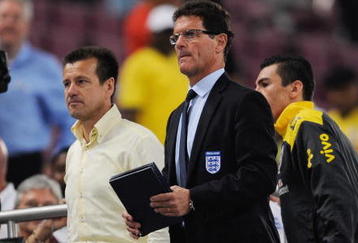 DOHA, QATAR - NOVEMBER 14: England manager Fabio Capello and Brazil manager Dunga look on during the International Friendly match between Brazil and England at the Khalifa Stadium on November 14, 2009 in Doha, Qatar.  (Photo by Michael Regan/Getty Images)