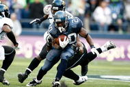 SEATTLE , WA - OCTOBER 11:  Justin Forsett #20 of the Seattle Seahawks runs with the ball against the Jacksonville Jaguars at Qwest Field on October 11, 2009 in Seattle, Washington.  (Photo by Jonathan Ferrey/Getty Images)