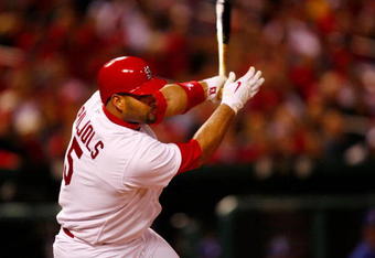 ST. LOUIS, MO - OCTOBER 10:  Albert Pujols #5 of the St. Louis Cardinals hits an RBI single against Los Angeles in the eighth inning of Game Three of the NLDS during the 2009 MLB Playoffs at Busch Stadium on October 10, 2009 in St. Louis, Missouri. (Photo by Dilip Vishwanat/Getty Images)