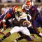 ATLANTA - SEPTEMBER 10:  Running back Jonathan Dwyer #21 of the Georgia Tech Yellow Jackets rushes upfield against Scotty Cooper #44, Andre Branch #40 and DeAndre McDaniel #2 of the Clemson Tigers at Bobby Dodd Stadium on September 10, 2009 in Atlanta, Georgia.  (Photo by Kevin C. Cox/Getty Images)