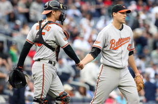 NEW YORK - SEPTEMBER 12: (L-R) Matt Wieters #15 of the Baltimore Orioles celebrates the win with pitcher Jim Johnson #43 against the New York Yankees on September 12, 2009 at Yankee Stadium in the Bronx borough of New York City.  (Photo by Nick Laham/Getty Images)