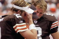 CLEVELAND - SEPTEMBER 28:  Offensive coordinator Bruce Arians of the Cleveland Browns talks to quarterbacks Tim Couch #2, Nate Hybl #8, and Kelly Holcomb #10 during a game against the Cincinnati Bengals at Cleveland Browns Stadium on September 28, 2003 in Cleveland, Ohio. The Bengals defeated the Browns 21-14.  (Photo by Phil Long/Getty Images)