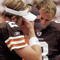 CLEVELAND - SEPTEMBER 28:  Offensive coordinator Bruce Arians of the Cleveland Browns talks to quarterbacks Tim Couch #2, Nate Hybl #8, and Kelly Holcomb #10 during a game against the Cincinnati Bengals at Cleveland Browns Stadium on September 28, 2003 in Cleveland, Ohio. The Bengals defeated the Browns 21-14.  (Photo by Phil Long/Getty Images)