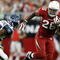 GLENDALE, AZ - NOVEMBER 15:  Beanie Wells #26 of the Arizona Cardinals carries the ball while being pursued by David Hawthorne #57 of the Seattle Seahawks in the second half at University of Phoenix Stadium on November 15, 2009 in Glendale, Arizona. The Cardinals defeated the Seahawks 31-20.  (Photo by Jeff Gross/Getty Images)