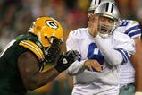 GREEN BAY, WI - NOVEMBER 15: Tony Romo #9 of the Dallas Cowboys closes his eyes as he is hit by Johnny Jolly #97 of the Green Bay Packers at Lambeau Field on November 15, 2009 in Green Bay, Wisconsin. The Packers defeated the Cowboys 17-7.  (Photo by Jonathan Daniel/Getty Images)
