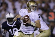 STATE COLLEGE, PA - SEPTEMBER 8:  Quarterback Jimmy Clausen #7  of Notre Dame runs out of the pocket looking for a receiver during the second half of the game between University of Notre Dame Fighting Irish and Penn State Nittany Lions September 8, 2007 in State College, Pennsylvania.  (Photo by Chris Gardner/Getty Images)
