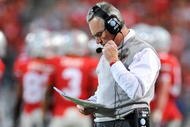 COLUMBUS, OH - NOVEMBER 14: Head coach Jim Tressel of the Ohio State Buckeyes checks his notes as the Buckeyes play the Iowa Hawkeyes at Ohio Stadium on November 14, 2009 in Columbus, Ohio. (Photo by Jamie Sabau/Getty Images)
