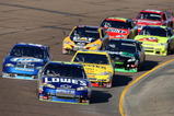 AVONDALE, AZ - NOVEMBER 15:  Jimmie Johnson, driver of the #48 Lowe's Chevrolet, leads a group of cars during the NASCAR Sprint Cup Series Checker O'Reilly Auto Parts 500 at Phoenix International Raceway on November 15, 2009 in Avondale, Arizona.  (Photo by Christian Petersen/Getty Images)