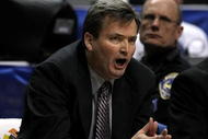 INDIANAPOLIS - MARCH 13: Head coach Bill Carmody of the Northwestern Wildcats coaches against the Minnesota Golden Gophers during the Big Ten Men's Basketball Tournament at Conseco Fieldhouse on March 13, 2008 in Indianapolis, Indiana. Minnesota won 55-52. (Photo by Jonathan Daniel/Getty Images)