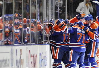 EDMONTON, AB - OCTOBER 3:  Gilbert Brule celebrates his goal with teammates (L-R) Andrew Cogliano, Lubomir Visnovsky, Ladislav Smid and Dustin Penner against the Calgary Flames in the second period during an NHL game on October 3, 2009 at Rexall Arena in Edmonton, Canada. L(Photo by Jimmy Jeong/Getty Images)