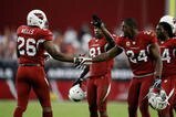 GLENDALE, AZ - NOVEMBER 15:  Beanie Wells #26 of the Arizona Cardinals celebrates a touchdown with Adrian Wilson #24 in the second half against the Seattle Seahawks at University of Phoenix Stadium on November 15, 2009 in Glendale, Arizona. The Cardinals defeated the Seahawks 31-20.  (Photo by Jeff Gross/Getty Images)