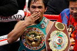 LAS VEGAS - NOVEMBER 14:  Manny Pacquiao celebrates his 12 round TKO victory against Miguel Cotto during their WBO welterweight title fight at the MGM Grand Garden Arena on November 14, 2009 in Las Vegas, Nevada.   (Photo by Ethan Miller/Getty Images)