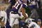 MINNEAPOLIS - NOVEMBER 15: Visanthe Shiancoe #81 of the Minnesota Vikings avoids Phillip Buchanon #31 of the Detroit Lions on November 15, 2009 at Hubert H. Humphrey Metrodome in Minneapolis, Minnesota. The Vikings defeated the Lions 27-10.  (Photo by Elsa/Getty Images)