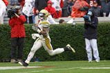 ATHENS, GA - NOVEMBER 29:  Running back Roddy Jones #20 of the Georgia Tech Yellow Jackets scores his second touchdown on a 54 yard run in the fourth quarter during the game against the Georgia Bulldogs at Sanford Stadium on November 29, 2008 in Athens, Georgia.  Jones ran for 214 yards and 2 touchdowns as the Yellow Jackets beat the Bulldogs 45-42.  (Photo by Mike Zarrilli/Getty Images)