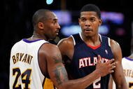 LOS ANGELES, CA - NOVEMBER 01:  Kobe Bryant #24 of the Los Angeles Lakers and Joe Johnson #2 of the Atlanta Hawks hug after the NBA basketball game at Staples Center on November 1, 2009 in Los Angeles, California. Bryant finished with 41 points and Johnson scored 27 points and the Lakers defeated the Hawks 118-110. NOTE TO USER: User expressly acknowledges and agrees that, by downloading and/or using this Photograph, user is consenting to the terms and conditions of the Getty Images License Agreement.  (Photo by Kevork Djansezian/Getty Images)