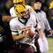 EUGENE,OR - NOVEMBER 14: Quarterback Samson Szakacsy #10 of the Arizona State Sun Devils avoids the rush of defensive end Will Tukuafu #39 of the Oregon Ducks in the third quarter of the game at Autzen Stadium on November 14, 2009 in Eugene, Oregon. Oregon Defeated arizona State 44-21. (Photo by Steve Dykes/Getty Images)
